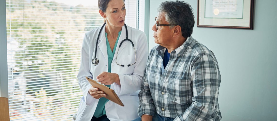 Doctor speaks with male patient