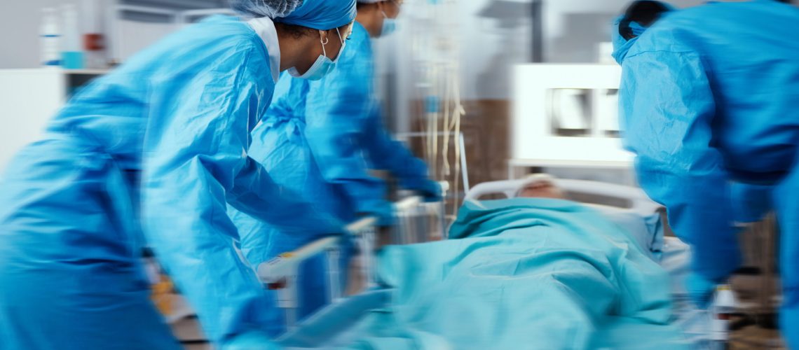 Women, man and hospital bed in motion blur of emergency surgery, healthcare wellness or risk condition operation. Doctors, nurses and medical workers with patient in busy er, theatre room or teamwork.