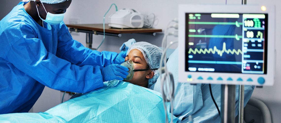 Healthcare, doctor and patient in mask for oxygen in surgery, emergency care and hospital bed. Breathing, monitor and air, surgeon helping person in operation, digital graphs to check medical results.